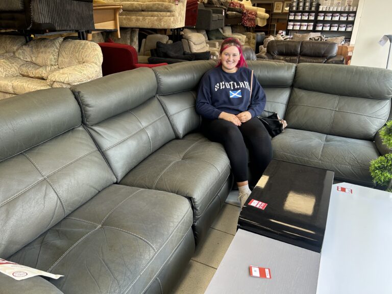 Supported person Lucie with her new sofa.