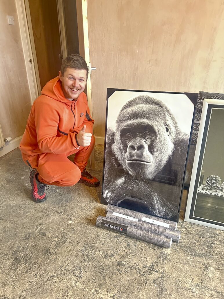 Supported person receiving Moving On Pack through Blue Triangle Fresh Start Appeal